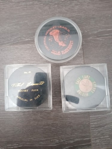 Three vintage ice hockey pucks - three,
